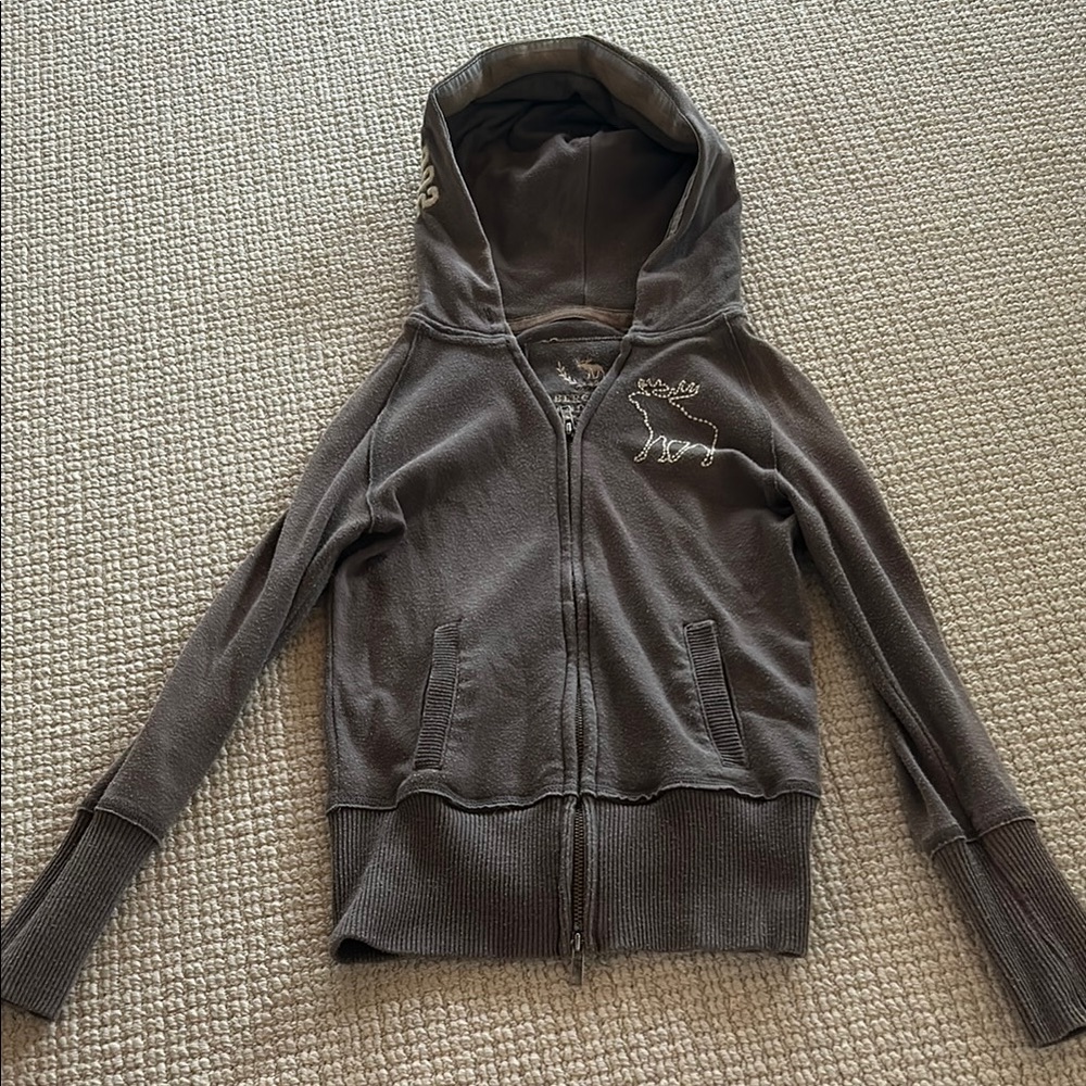 Gray Zip-Up Hoodie with Embroidered Design
